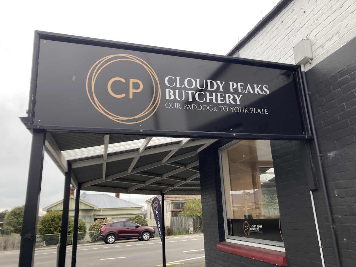The gold CP monogram and Cloudy Peaks Butchery signage on the shopfront